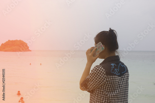 Woman standing call of the sea