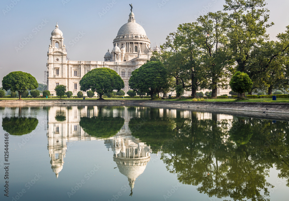 Victoria Memorial architectural building monument and museum at Kolkata built in the memory of Queen Victoria. Fresh air, lovely gardens and calm lakes surround the historic building.