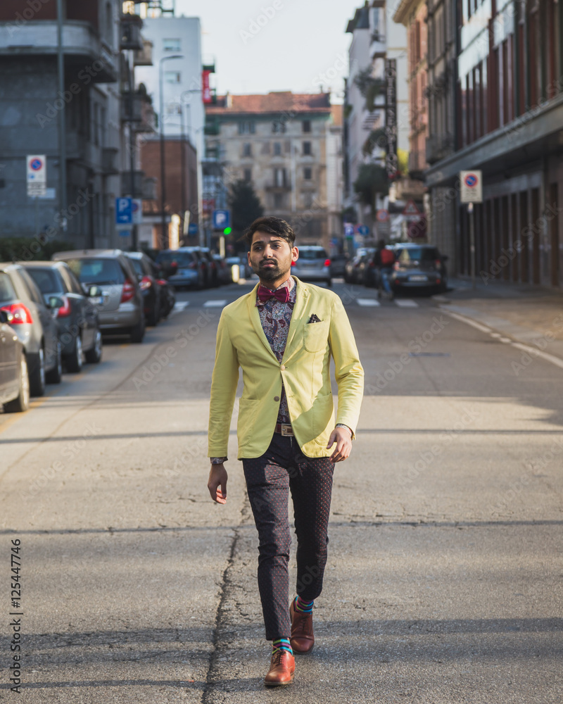Indian handsome man walking in an urban context