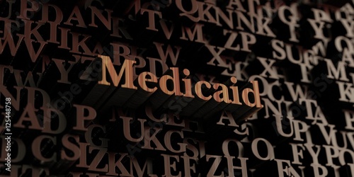 Medicaid - Wooden 3D rendered letters/message. Can be used for an online banner ad or a print postcard.