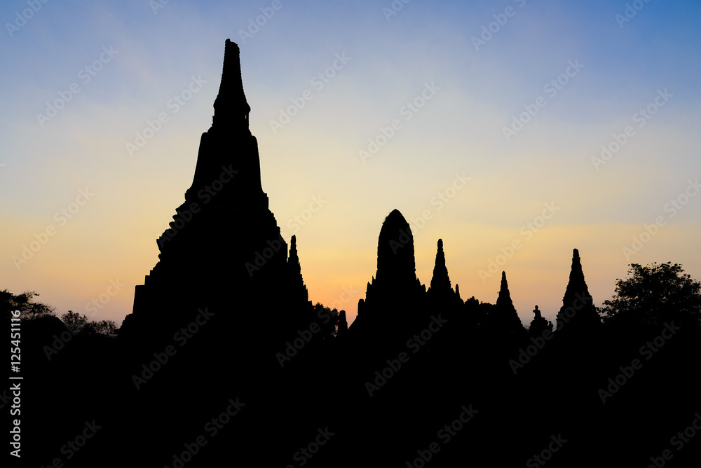 The silhouette scene of the ancient temple in Ayuthaya historical park.The twilight scene at the ancient Buddha temple in Ayuthaya ,Thailand.