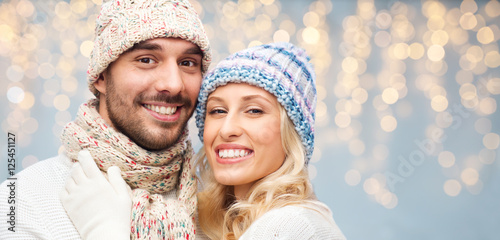 close up of happy couple in winter hats