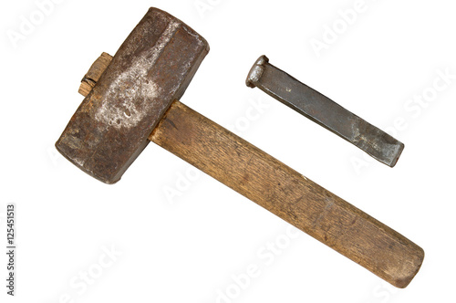 Old sledgehammer and chisel isolated on white background