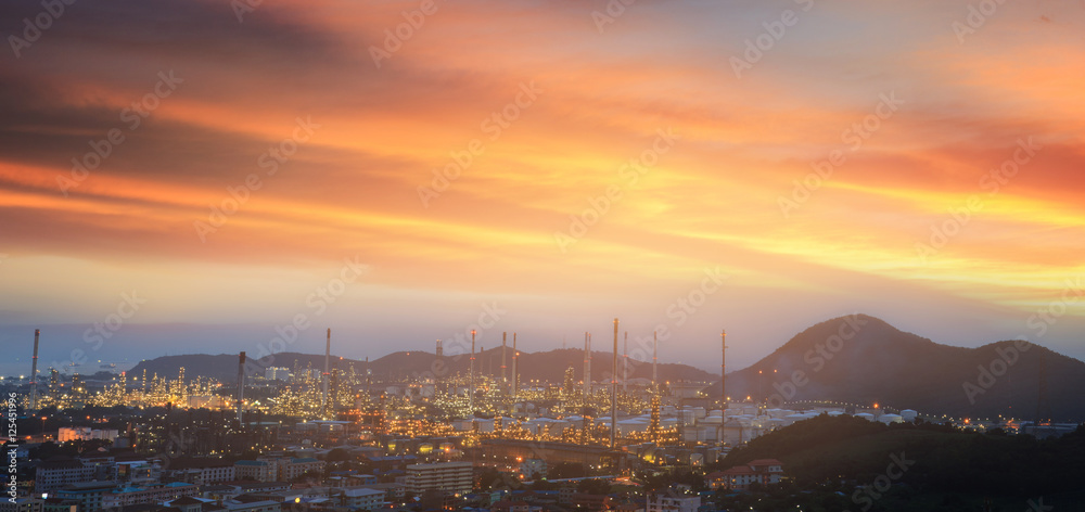 Fototapeta premium oil refinery, fuel manufacturer with city on beautiful sunset ba
