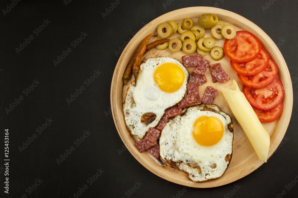 Fried Eggs on a plate. A hearty breakfast for athletes. Healthy food.
Fried Eggs on a plate. A hearty breakfast for athletes. Healthy food.