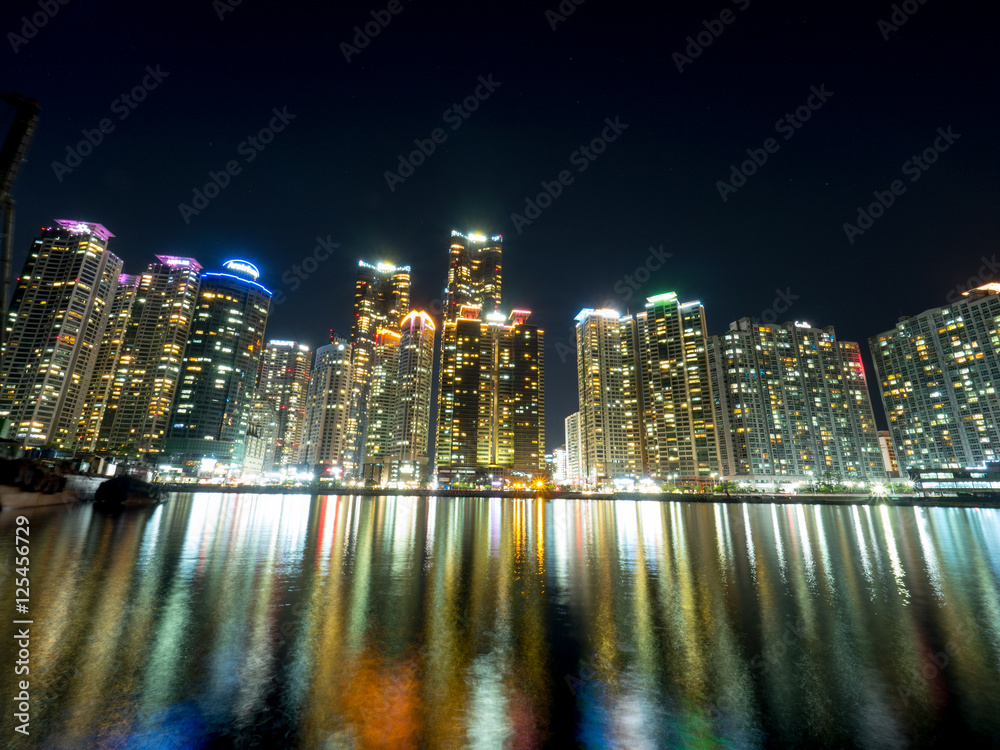 Night view of several buildings over the city's marine harbor in Busan Night view of several buildings over the city's marine harbor in Busan