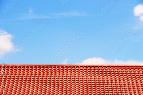 the red roof and blue sky backgrounds