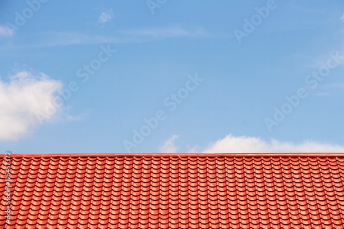the red roof and blue sky backgrounds