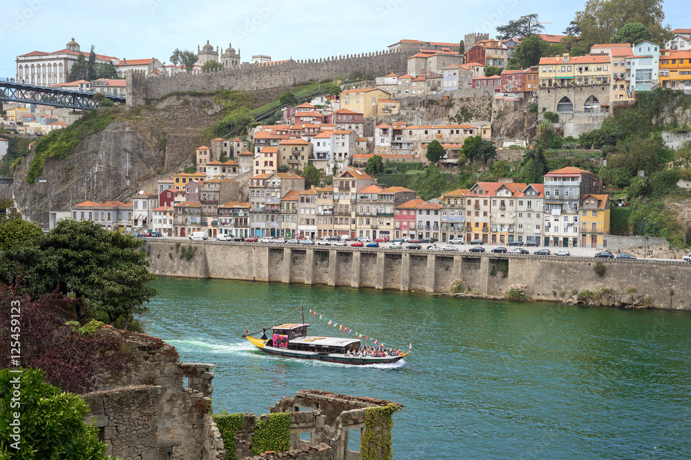 Porto Oporto tourist boat cruise Douro river view old romantic ruins church architecture historic downtown 