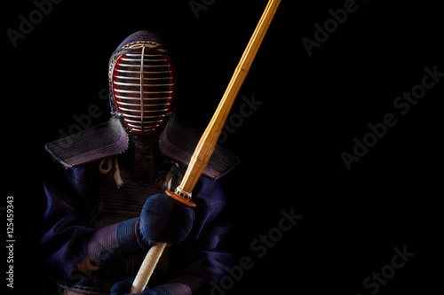Portrait of man kendo fighter with bokuto