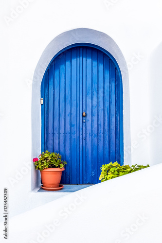 white wall with blue door