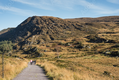 Hikers walking on the old Kenmore Road trail in the ring of Kerry