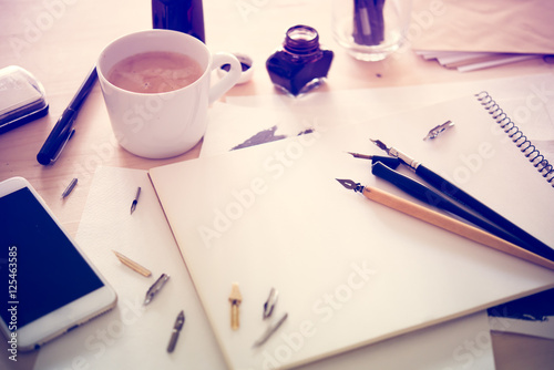 Paper, ink and calligraphy pens. Lettering workshop details