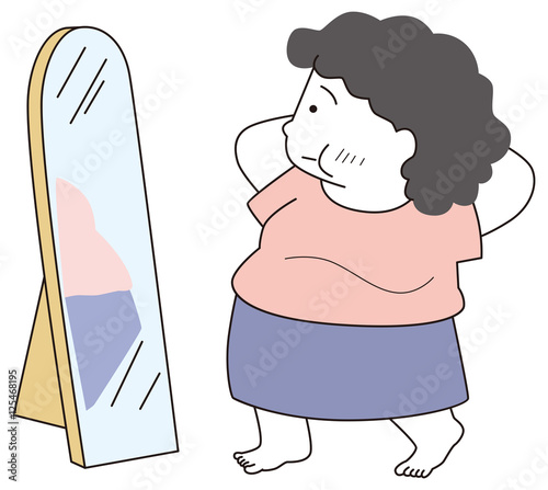 鏡を見る太り気味の女性