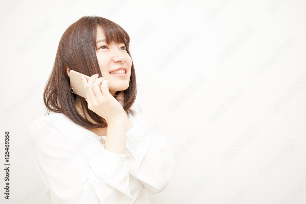 Young woman talking on the phone with smile Young woman talking on the phone with smile