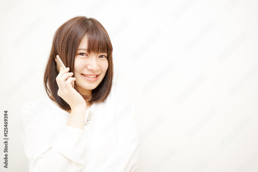 Young woman talking on the phone with smile Young woman talking on the phone with smile