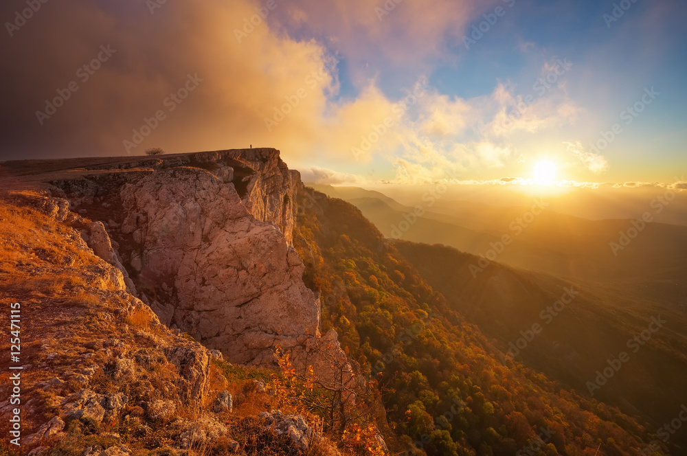 Beautiful mountain landscape with sunset sky in autumn time