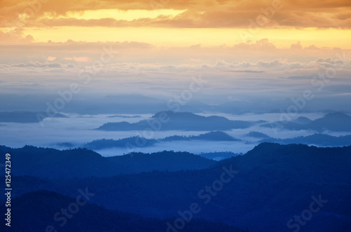 Foggy landscape  View on top mountains and winter morning fog.