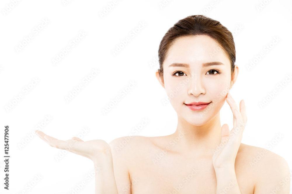 young woman showing empty copy space on the hand palm young woman showing empty copy space on the hand palm
