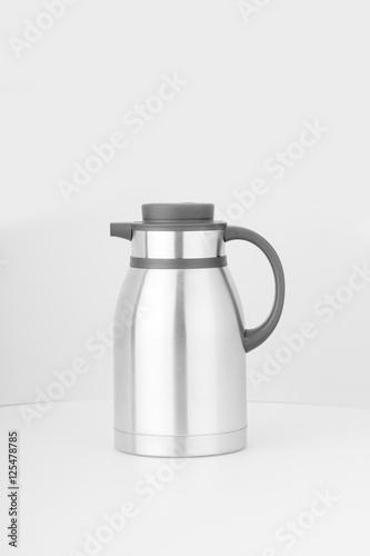 Thermo or  flask from stainless stee on background