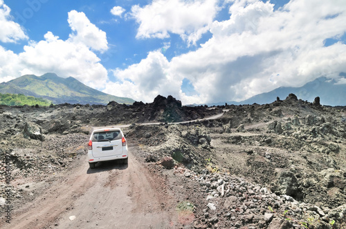the caldera ridge road among view of extinct crater of the volca photo
