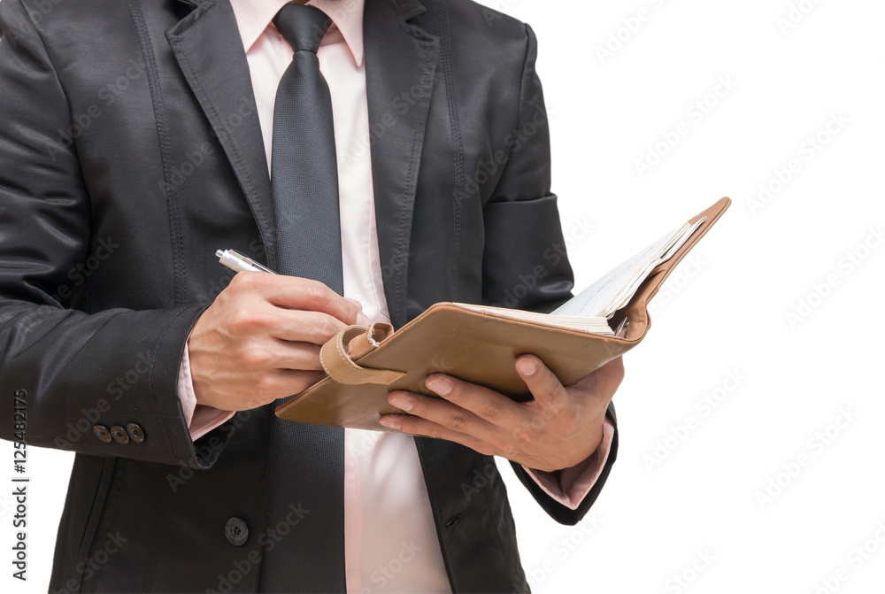 Businessman writing the note book on white background Businessman writing the note book on white background