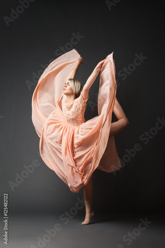 Fototapeta Naklejka Na Ścianę i Meble -  Woman dancing in chiffon dress