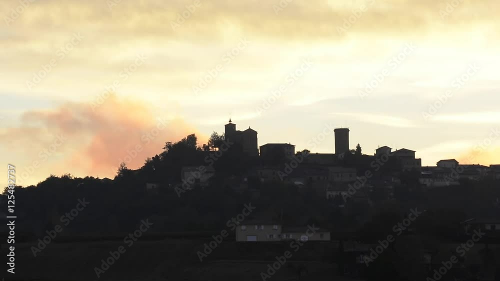 Clouds movement at sunrise in Beaujolais land, Oingt village Clouds movement at sunrise in Beaujolais land, Oingt village