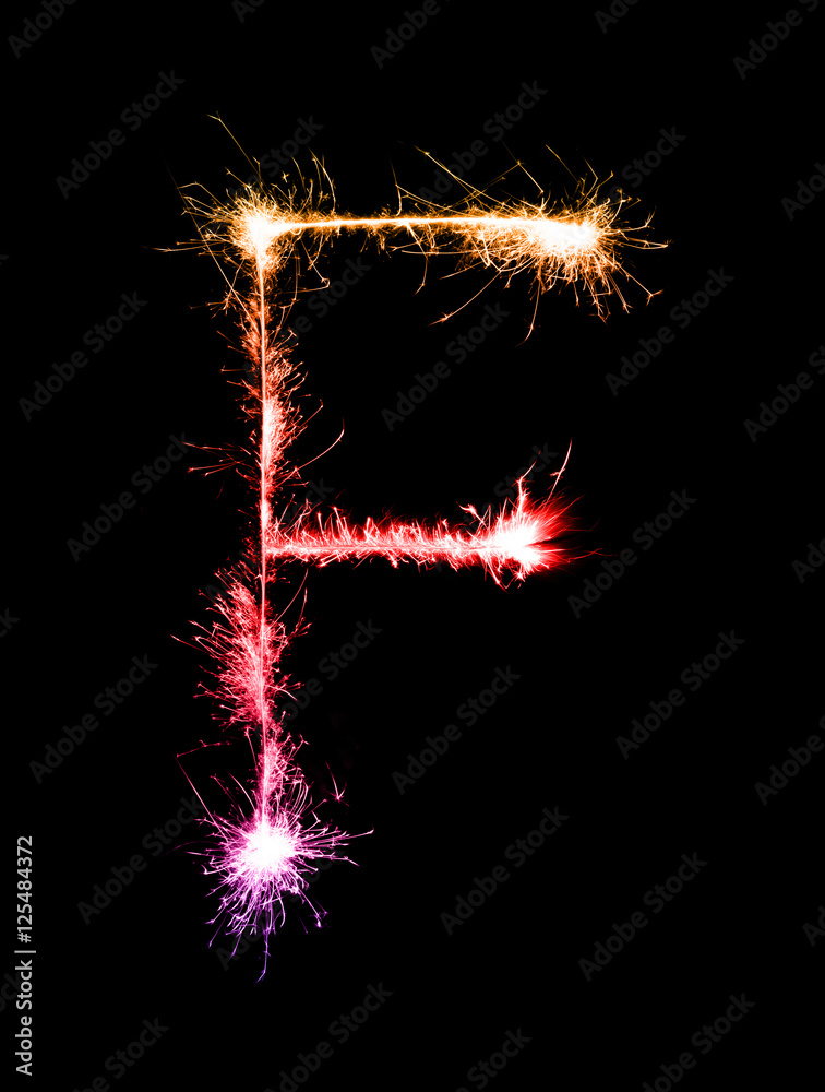 Sparkler firework light alphabet F (Capital Letters) at night Sparkler firework light alphabet F (Capital Letters) at night