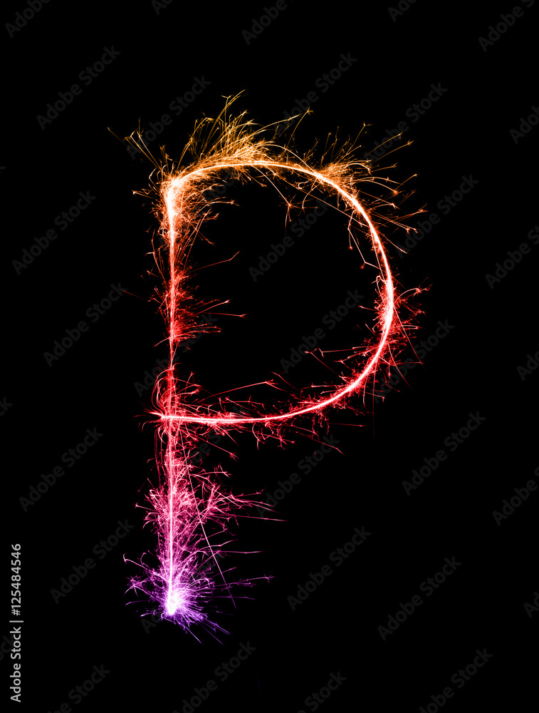 Sparkler firework light alphabet P at night