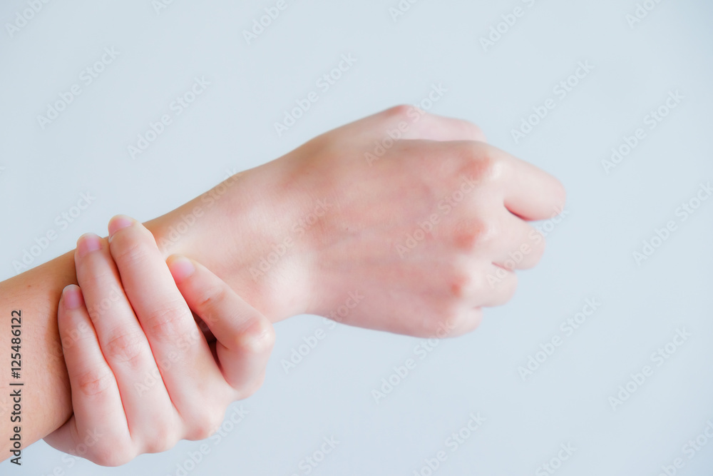 soft focus on hand of woman feel pain that are sign of Rheumatoi