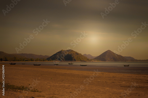 Small fishing boats parked on the beach