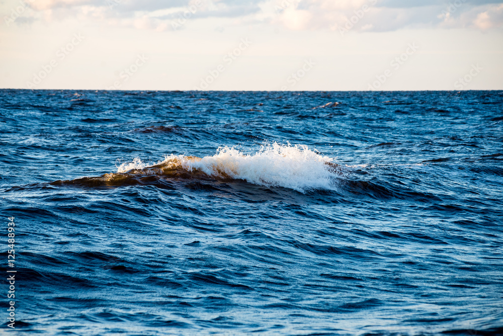 Fototapeta premium comfortable beach of the baltic sea with water crashing on the r