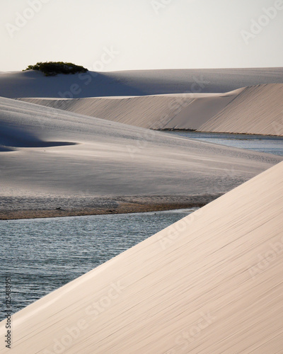 Sand dunes and freshwater lagoons found in the Lençóis Maranhenses National Park. Maranhão, Brazil. photo