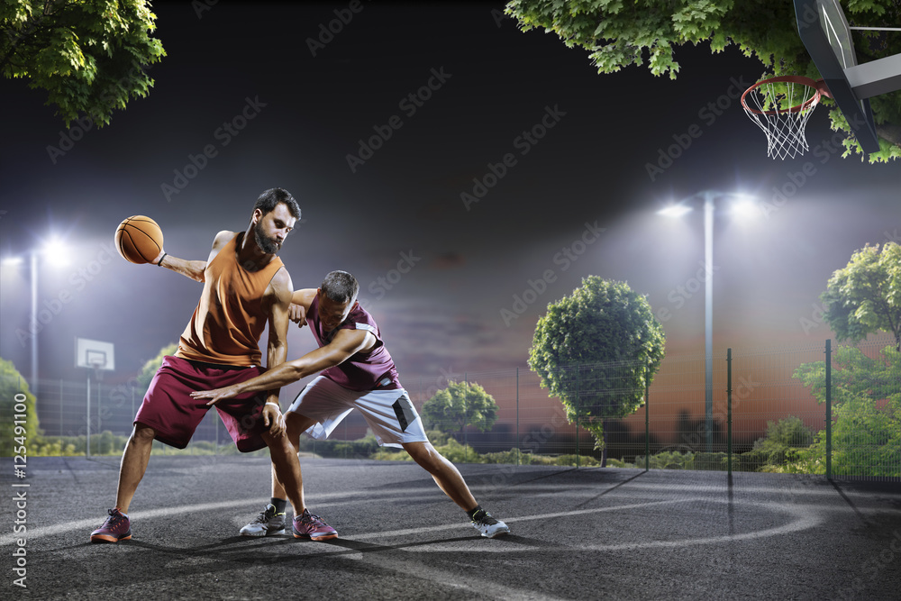 Basketball players in action on court