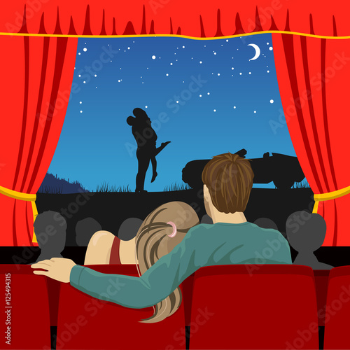 couple of lovers watching romantic movie in cinema theater