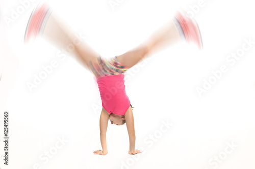 Girl doing a cartwheel at high speed.
