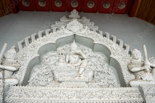 White statue is on the roof of popuplar temple in the Norht of Thailand photo