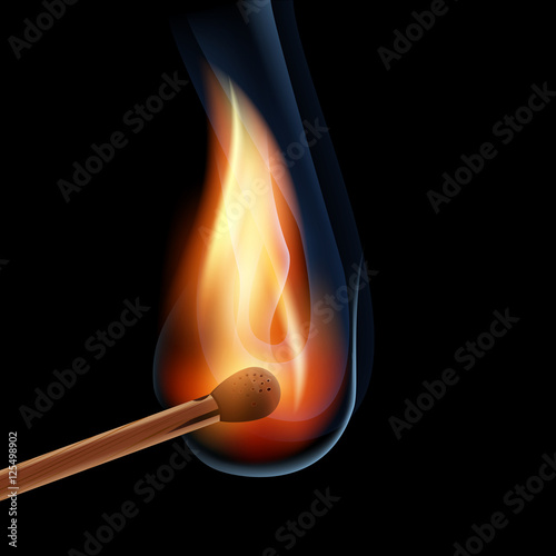 burning wooden match on a black background