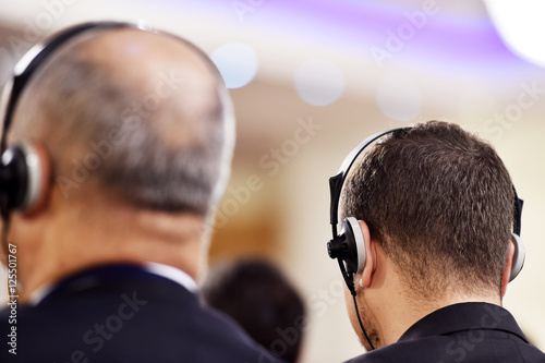 Man using headphones for translation