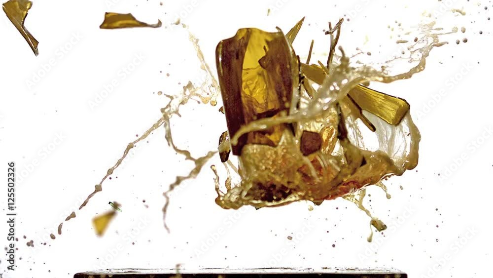 Bottle of Beer falling, Breaking and Splashing on Steel Plate against White Background, Slow motion
