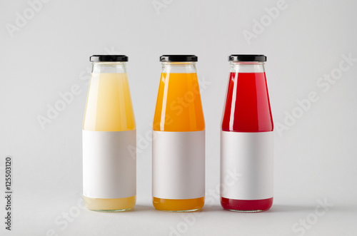 Juice Bottle Mock-Up - Three Bottles. Horizontal Label photo
