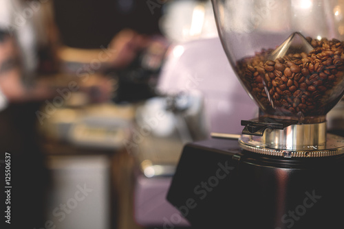seeds of coffee over kitchen background