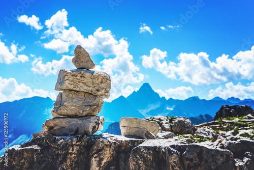 Bilde på lerret Rock cairn marking a hiking route in the alps