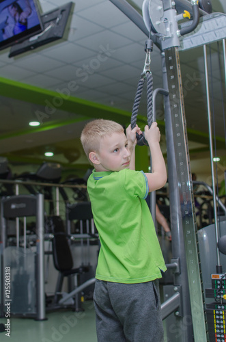 boy is training in the gym photo