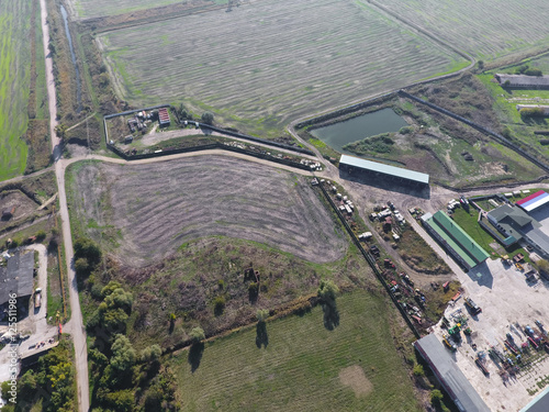 Top view of the village. One can see the roofs of the houses and gardens. Road in the village. Village bird's-eye view