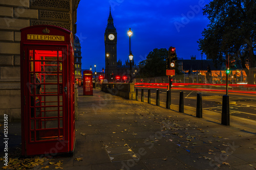Red telephone booth and Big Ben in London, UK. The symbols of London