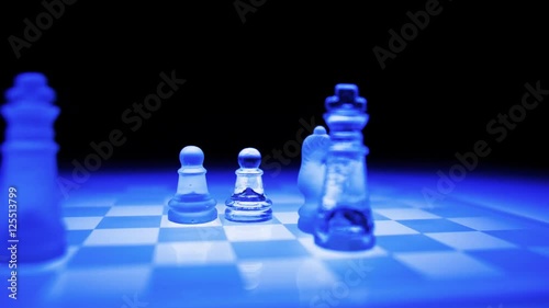 stop motion orbital shot of a blue futuristic glass chess board playing itself