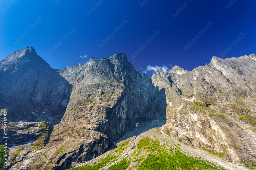 Mountains with green gras and blue sky, Andalses, Norway Mountains with green gras and blue sky, Andalses, Norway