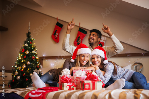 Cheerful friends having fun together during Christmas holidays. photo